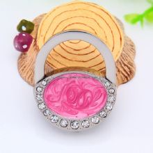 Folding table top bag holder images