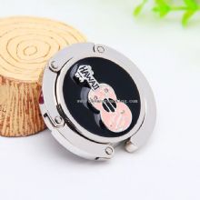 Metal folding bag hanger images