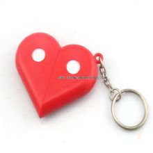 Heart shaped pill box with keychain images