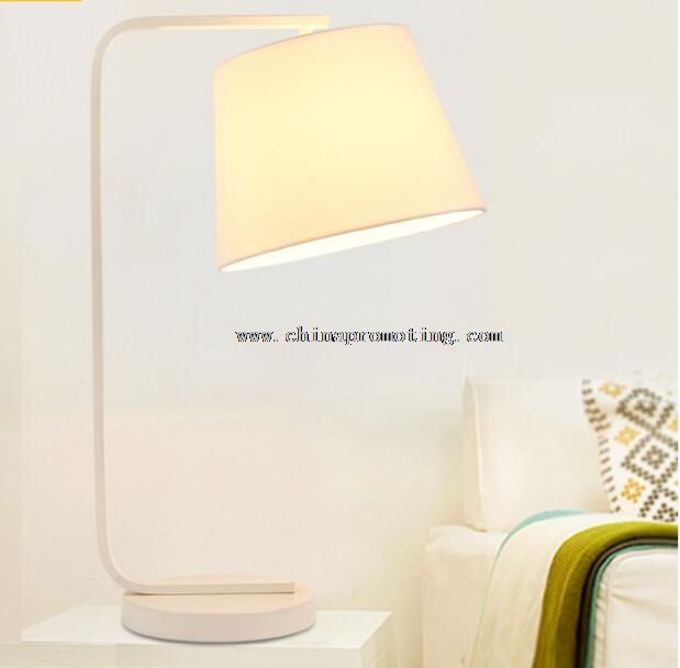 LED desk lamp with white fabric shade
