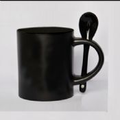 Tasse en céramique avec couvercle cuillère images