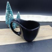Speziell geformte Keramik Kaffeetasse images